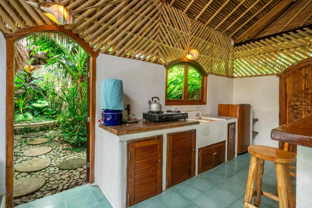 Kuchyň nebo kuchyňský kout v ubytování Mu Bungalows