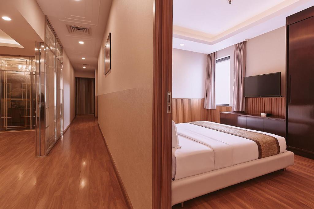 Postel nebo postele na pokoji v ubytování Mercury Boutique Hotel