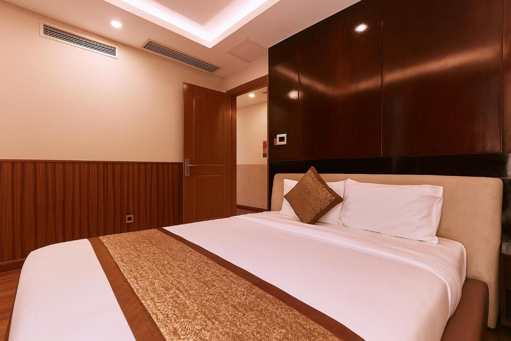 Postel nebo postele na pokoji v ubytování Mercury Boutique Hotel