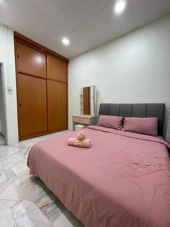 Ένα ή περισσότερα κρεβάτια σε δωμάτιο στο Garden Homes Simple Seremban 2