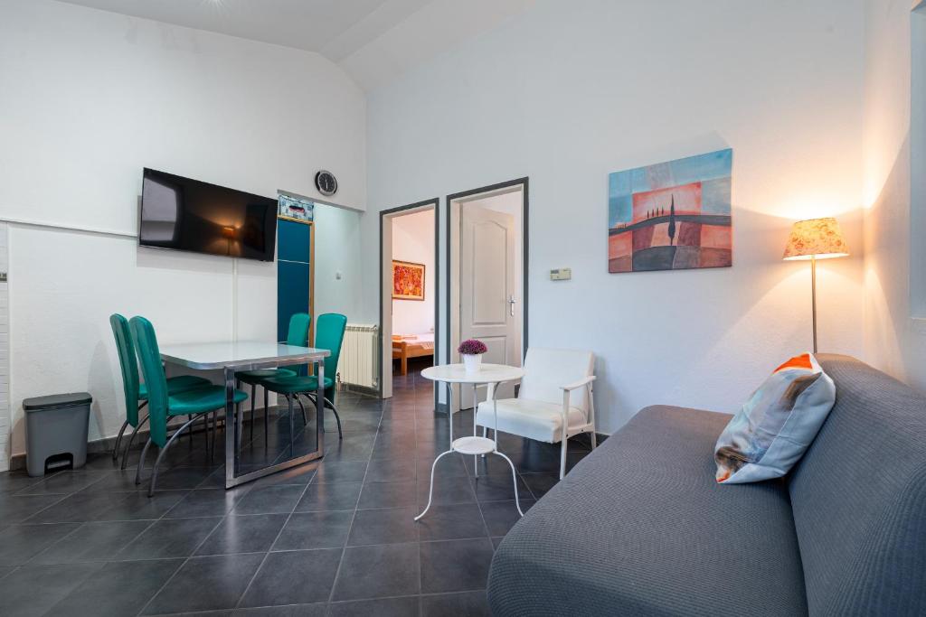 TV a/nebo společenská místnost v ubytování Grifon 72 Apartments