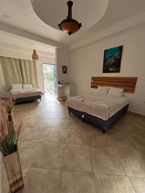 Postel nebo postele na pokoji v ubytování Hotel Remanso Beach