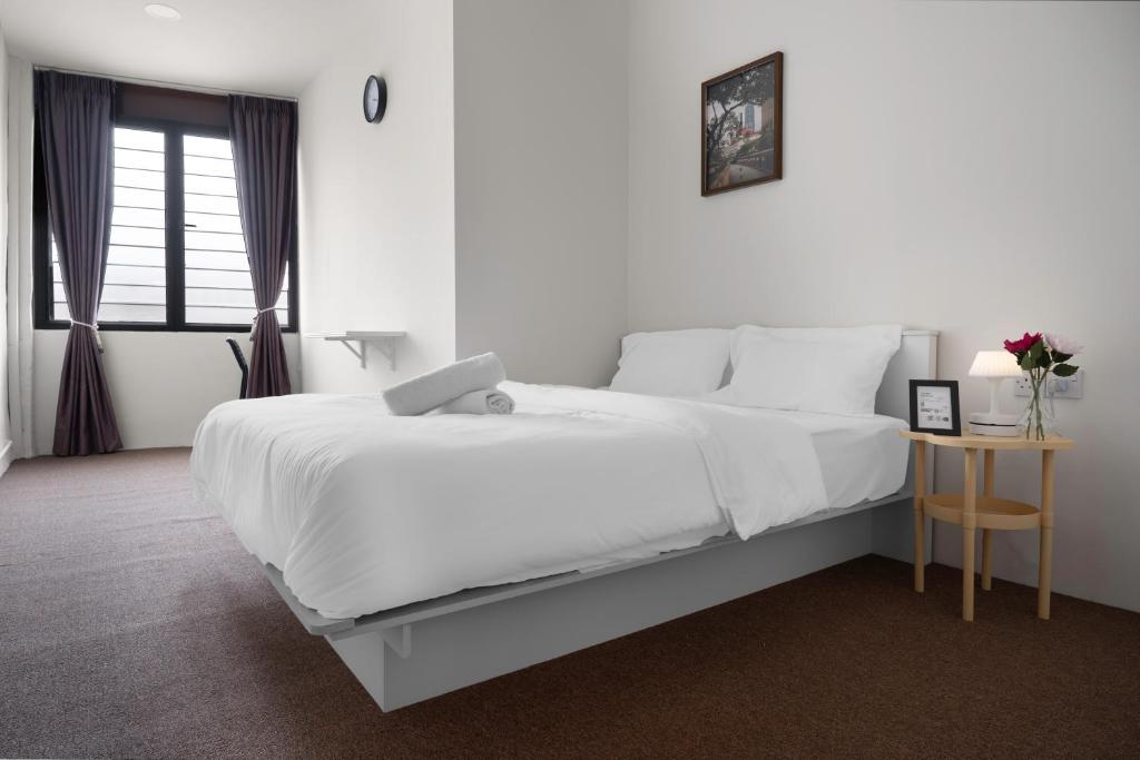 Postel nebo postele na pokoji v ubytování A Cozy Place Penang