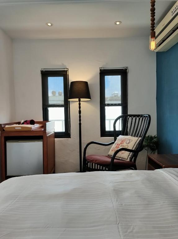 Rúm í herbergi á Kenting Cozy B&B