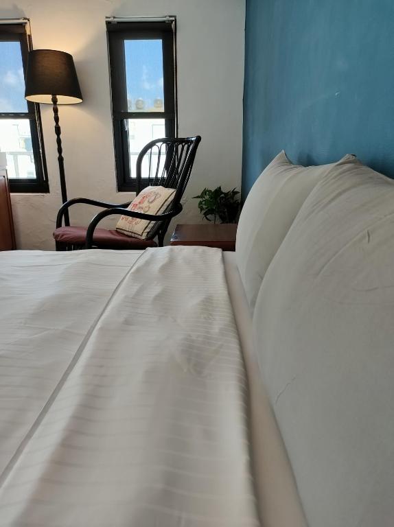 Rúm í herbergi á Kenting Cozy B&B