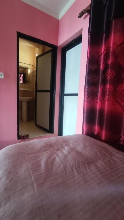 Postel nebo postele na pokoji v ubytování Hotel Pigeon Prince