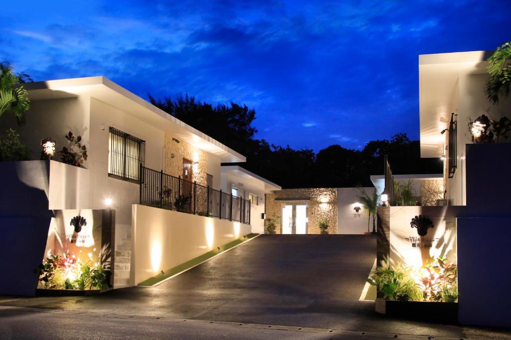 a villa with a driveway at night at -Villa Rikyu- 離宮別館 in Miyako Island