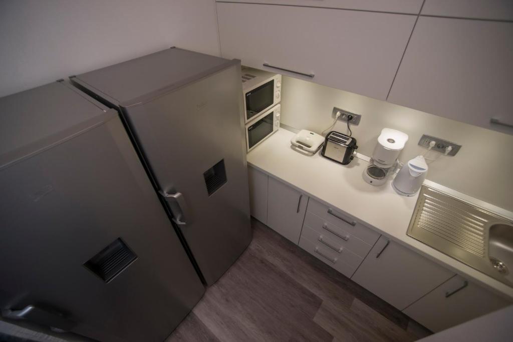 Kuchyň nebo kuchyňský kout v ubytování Hostel Sol
