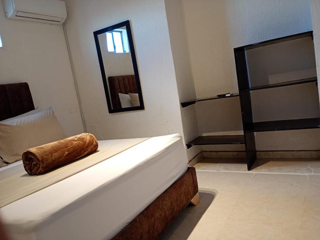 Postel nebo postele na pokoji v ubytování Hotel Aerocafe Pereira