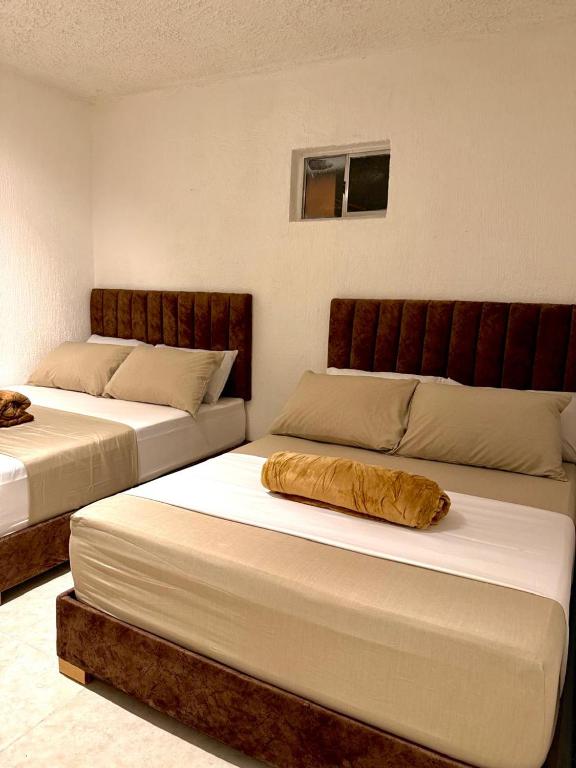 Postel nebo postele na pokoji v ubytování Hotel Aerocafe Pereira