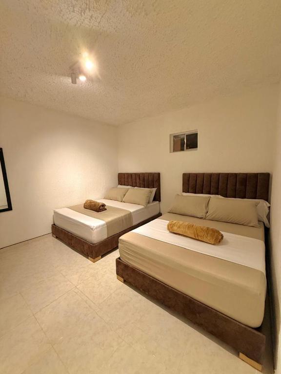 Postel nebo postele na pokoji v ubytování Hotel Aerocafe Pereira
