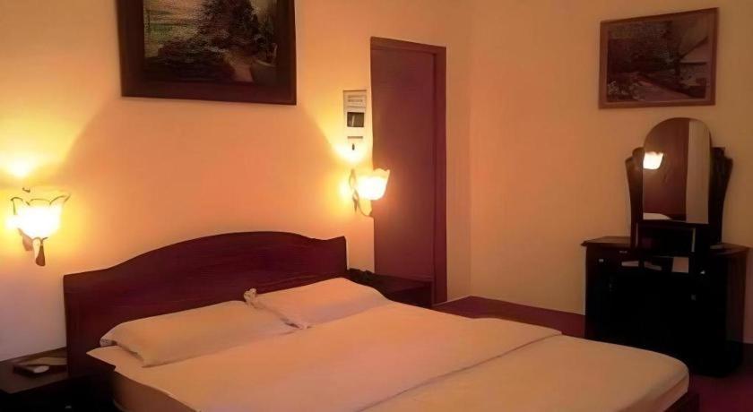 Postel nebo postele na pokoji v ubytování Diamond Resort Bien Hoa