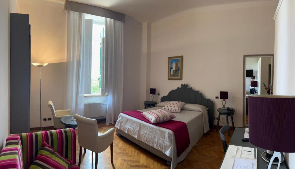 Łóżko lub łóżka w pokoju w obiekcie Relais Villa Sant'Isidoro