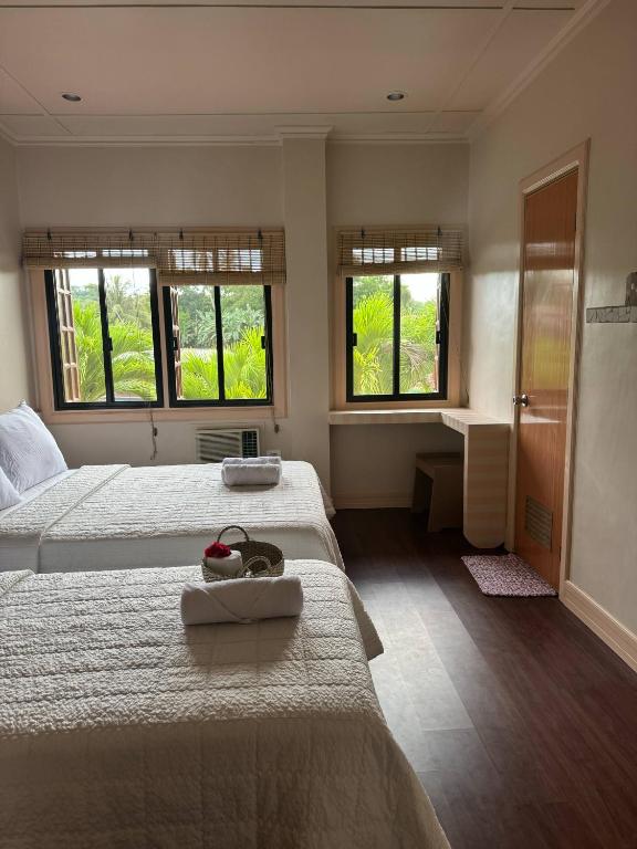 Postel nebo postele na pokoji v ubytování Stefanie Grace Paradise Inn