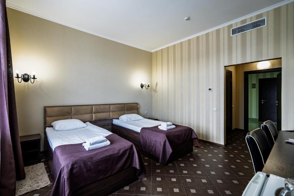 Postel nebo postele na pokoji v ubytování Hotel Verhovina