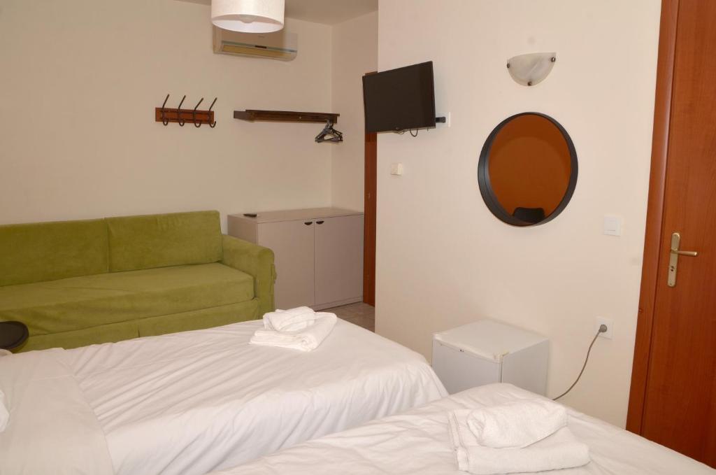 Postel nebo postele na pokoji v ubytování Centroom Suites