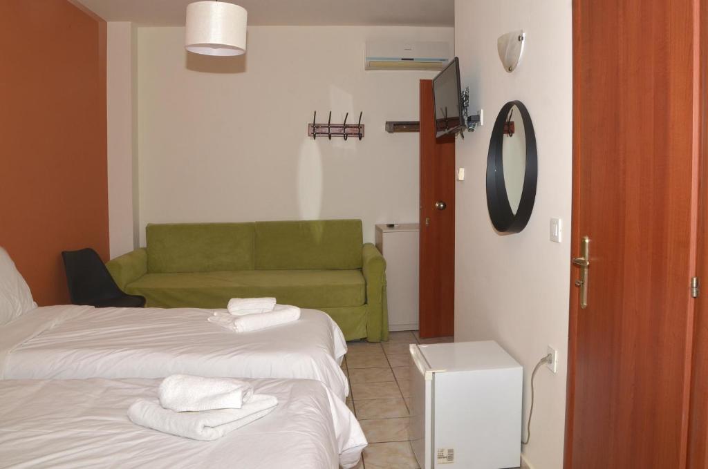 Postel nebo postele na pokoji v ubytování Centroom Suites