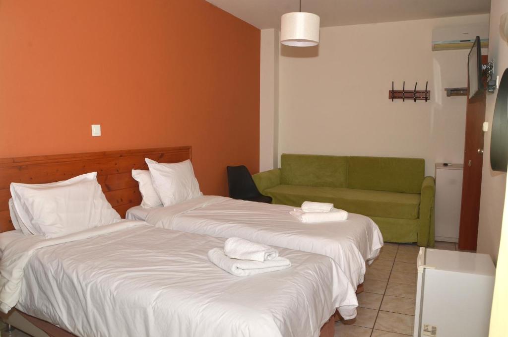 Postel nebo postele na pokoji v ubytování Centroom Suites