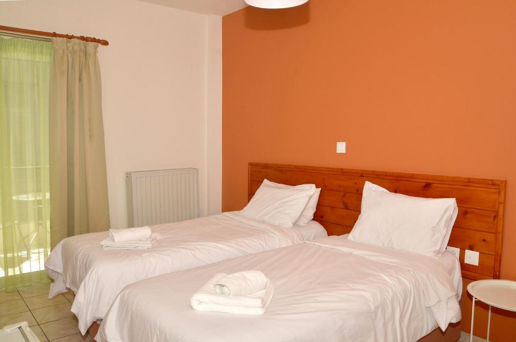 Postel nebo postele na pokoji v ubytování Centroom Suites