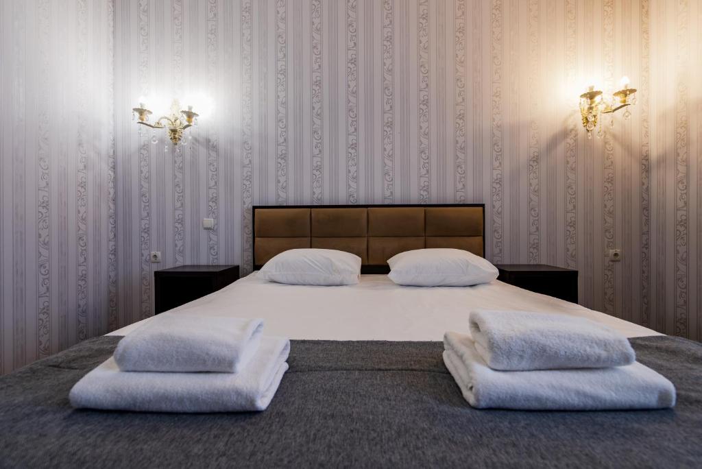Postel nebo postele na pokoji v ubytování Hotel Verhovina