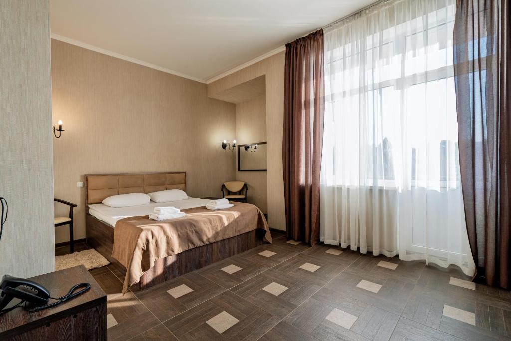 Postel nebo postele na pokoji v ubytování Hotel Verhovina