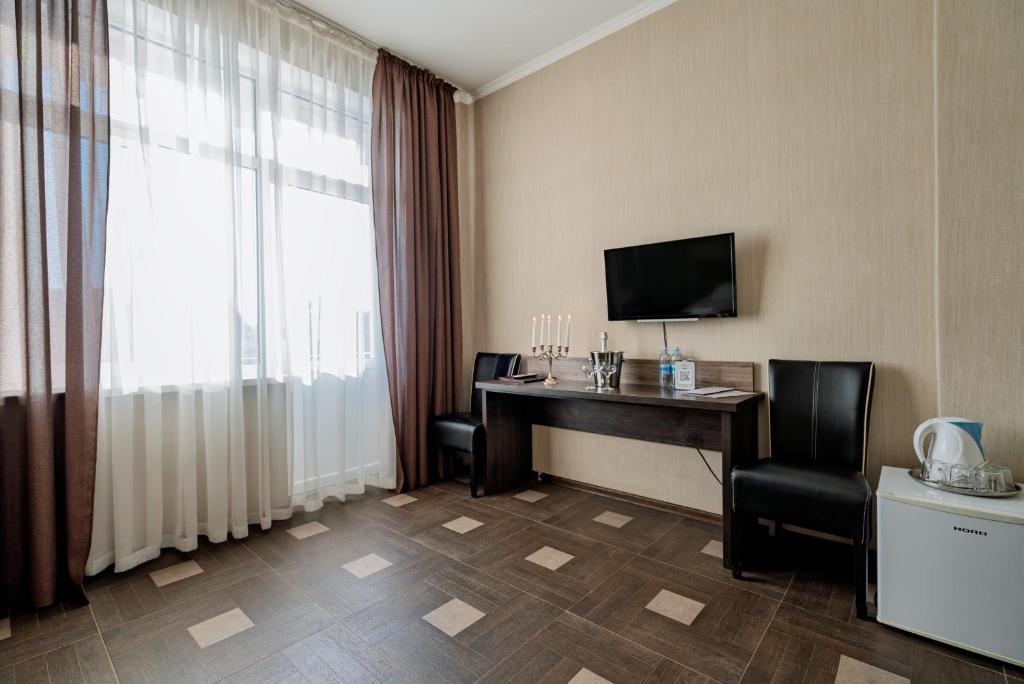 TV a/nebo společenská místnost v ubytování Hotel Verhovina