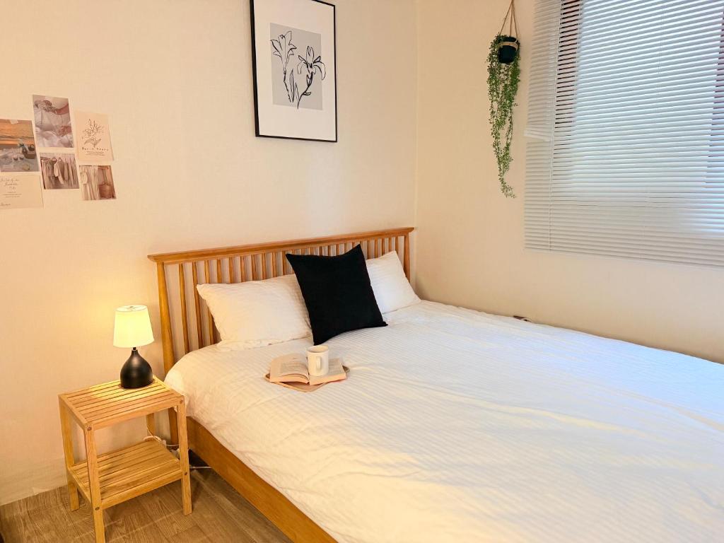 Katil atau katil-katil dalam bilik di Ogeum Stay, Songpa
