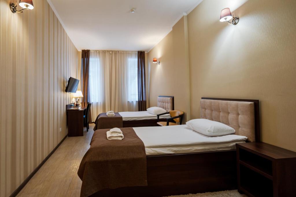 Postel nebo postele na pokoji v ubytování Hotel Verhovina