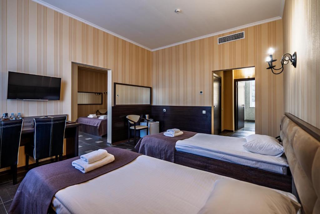 Postel nebo postele na pokoji v ubytování Hotel Verhovina