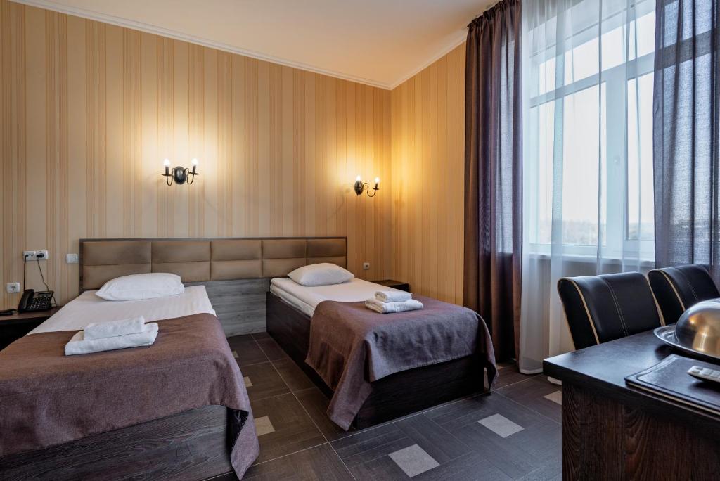 Postel nebo postele na pokoji v ubytování Hotel Verhovina