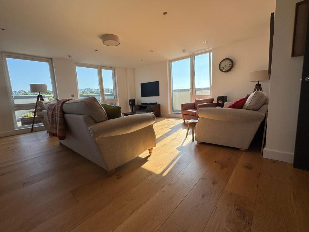 a living room with two couches and a television at The Viewpoint in Brighton & Hove