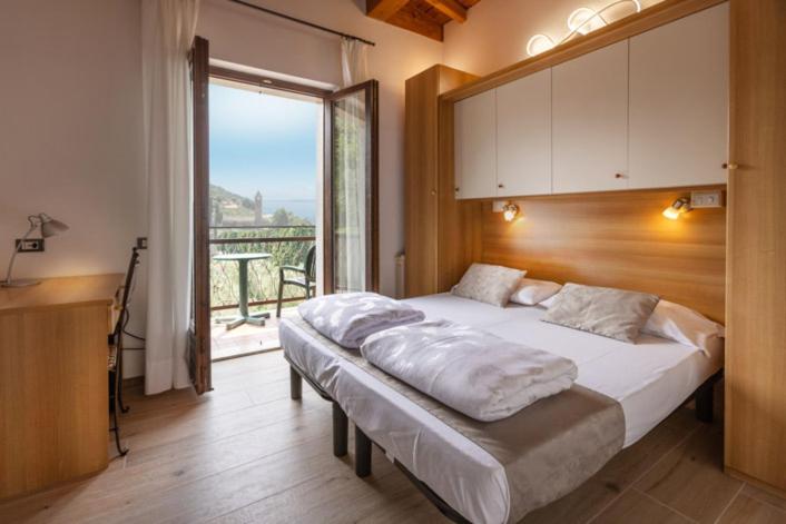 Postel nebo postele na pokoji v ubytování Hotel Rabay