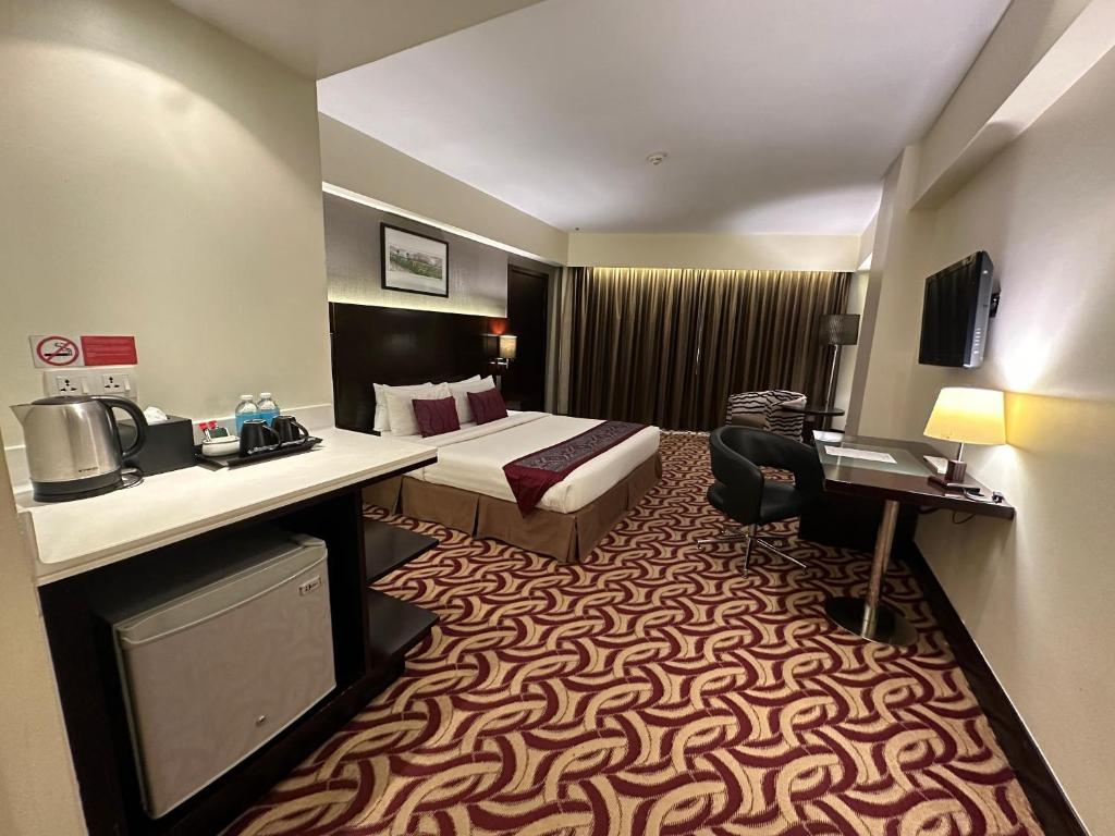 TV a/nebo společenská místnost v ubytování Ming Garden Hotel & Residences
