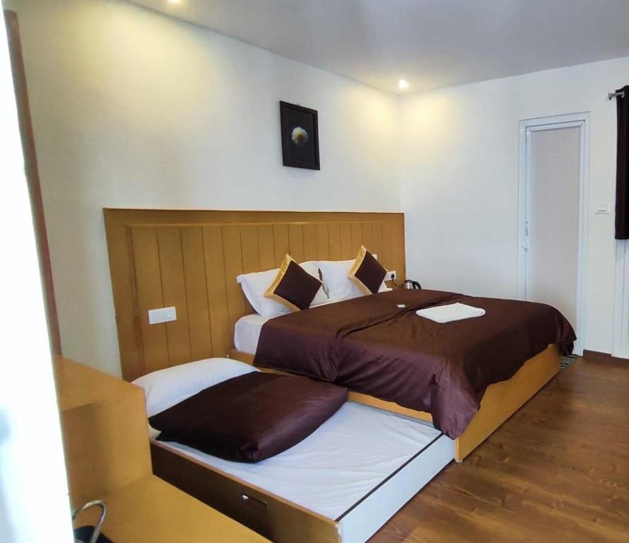 Letto o letti in una camera di Magizham Homestay