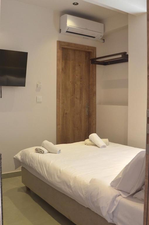 Postel nebo postele na pokoji v ubytování Centroom Suites