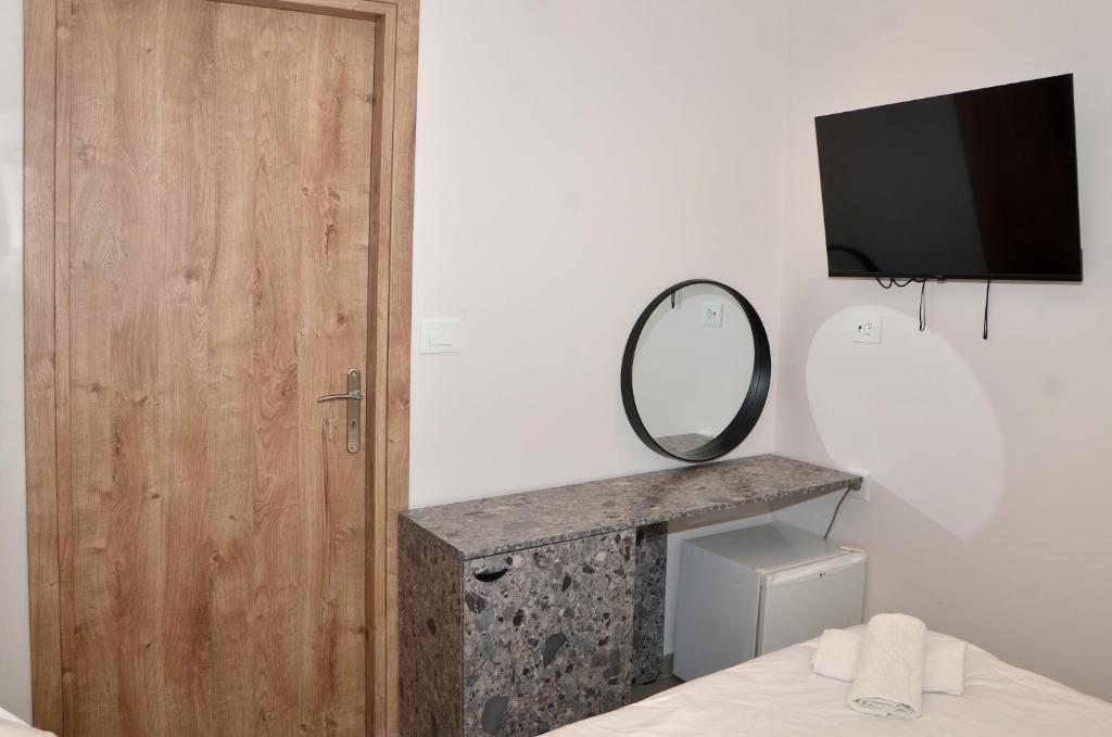 TV a/nebo společenská místnost v ubytování Centroom Suites