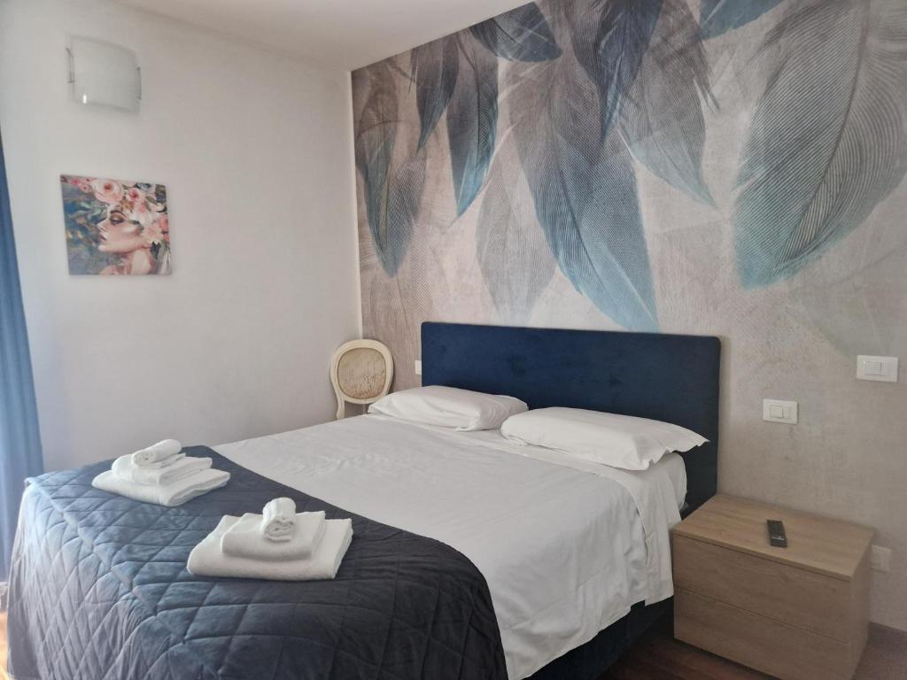 Postel nebo postele na pokoji v ubytování Asso Residence Ospedale