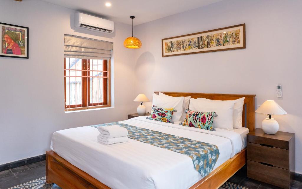 Postel nebo postele na pokoji v ubytování Beng Mealea Lodge