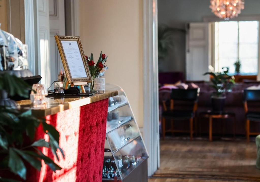 a room with a counter with a picture on it at Rosersbergs Slottshotell in Rosersberg