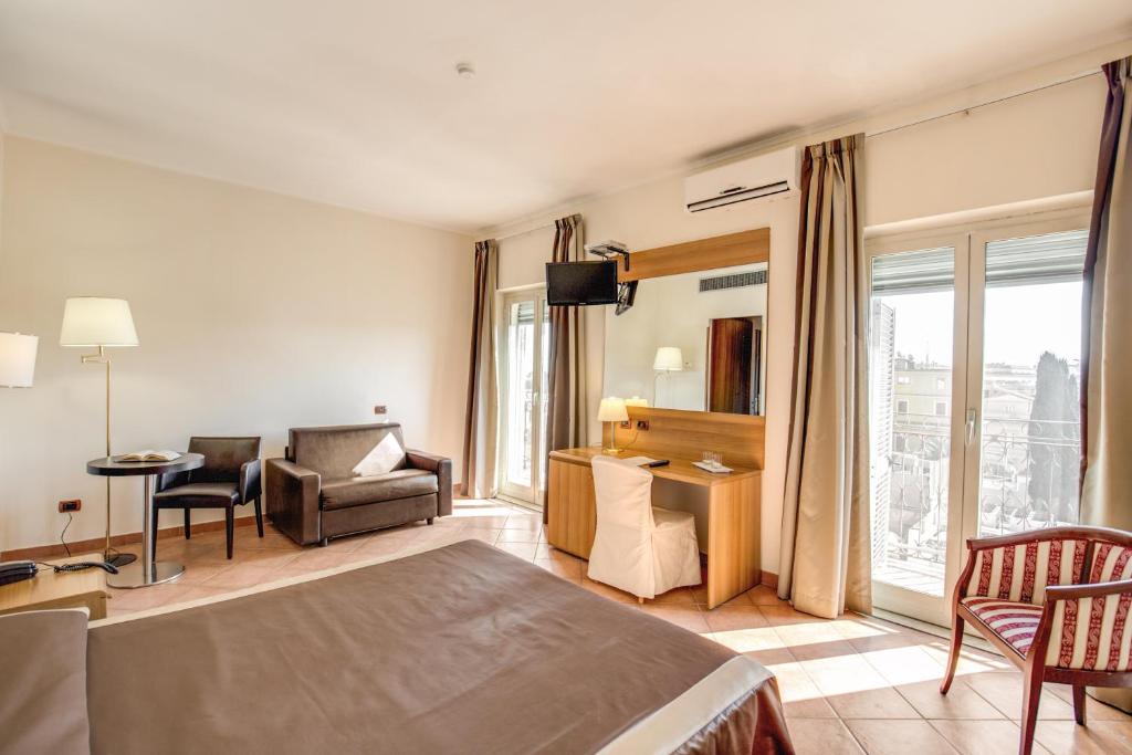 Postel nebo postele na pokoji v ubytování Hotel San Marco