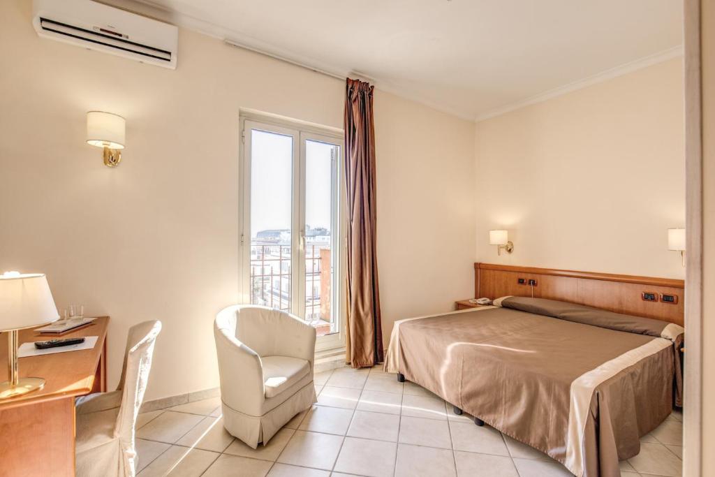 Postel nebo postele na pokoji v ubytování Hotel San Marco