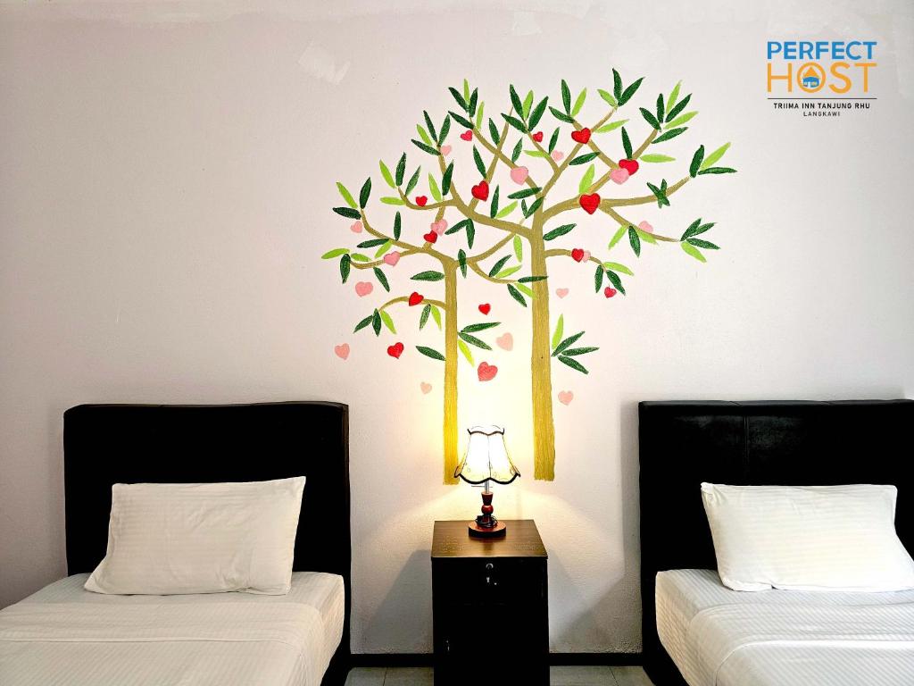 Letto o letti in una camera di Triima Inn Tanjung Rhu by Perfect Host
