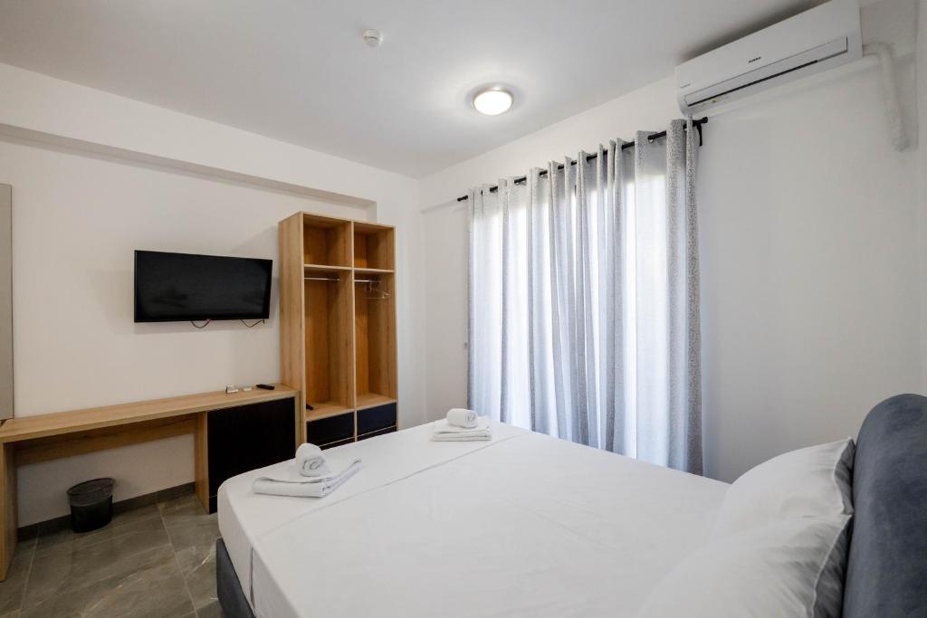Postel nebo postele na pokoji v ubytování Vullkan Hotel