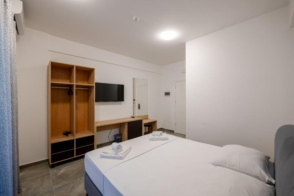 Postel nebo postele na pokoji v ubytování Vullkan Hotel