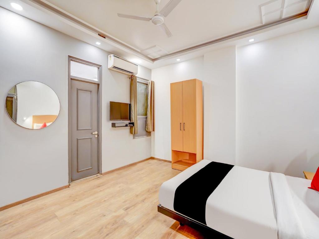 Postel nebo postele na pokoji v ubytování Super Capital O Jp Tower