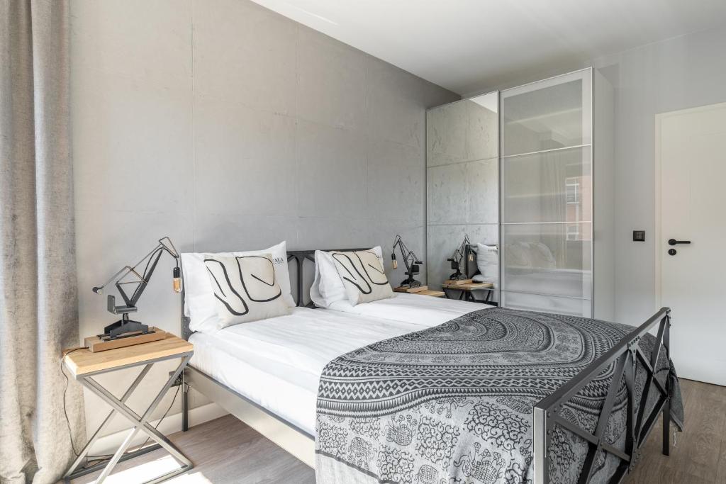 Posteľ alebo postele v izbe v ubytovaní Scala 60C City Center Apartments with Parking by Lion Apartments