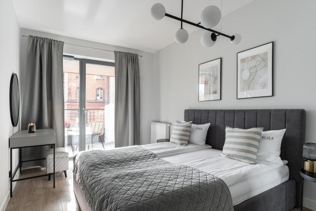 Posteľ alebo postele v izbe v ubytovaní Scala 60C City Center Apartments with Parking by Lion Apartments
