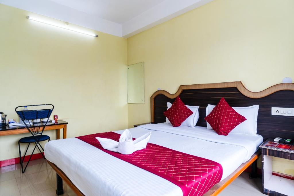 Postel nebo postele na pokoji v ubytování HOTEL NILADRII GALAXY