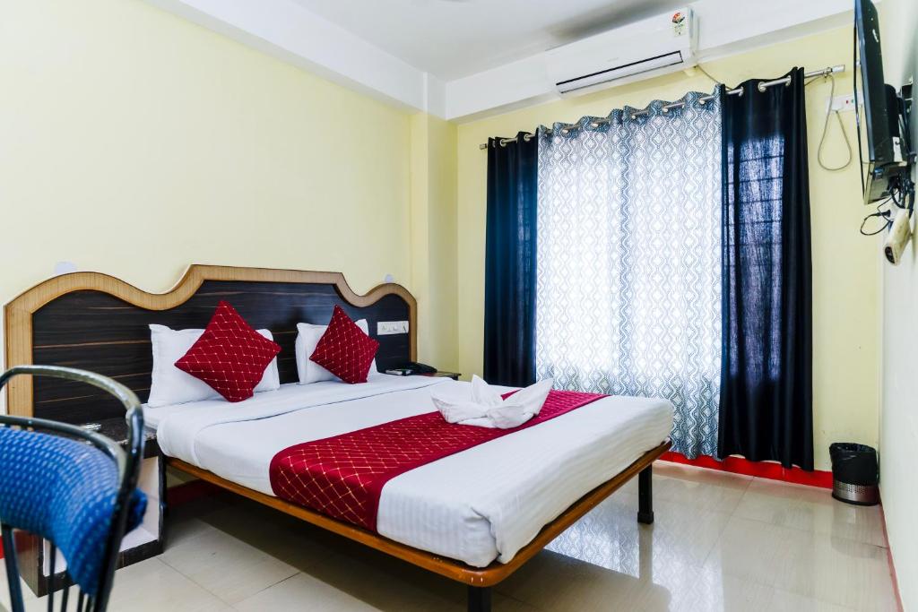 Postel nebo postele na pokoji v ubytování HOTEL NILADRII GALAXY