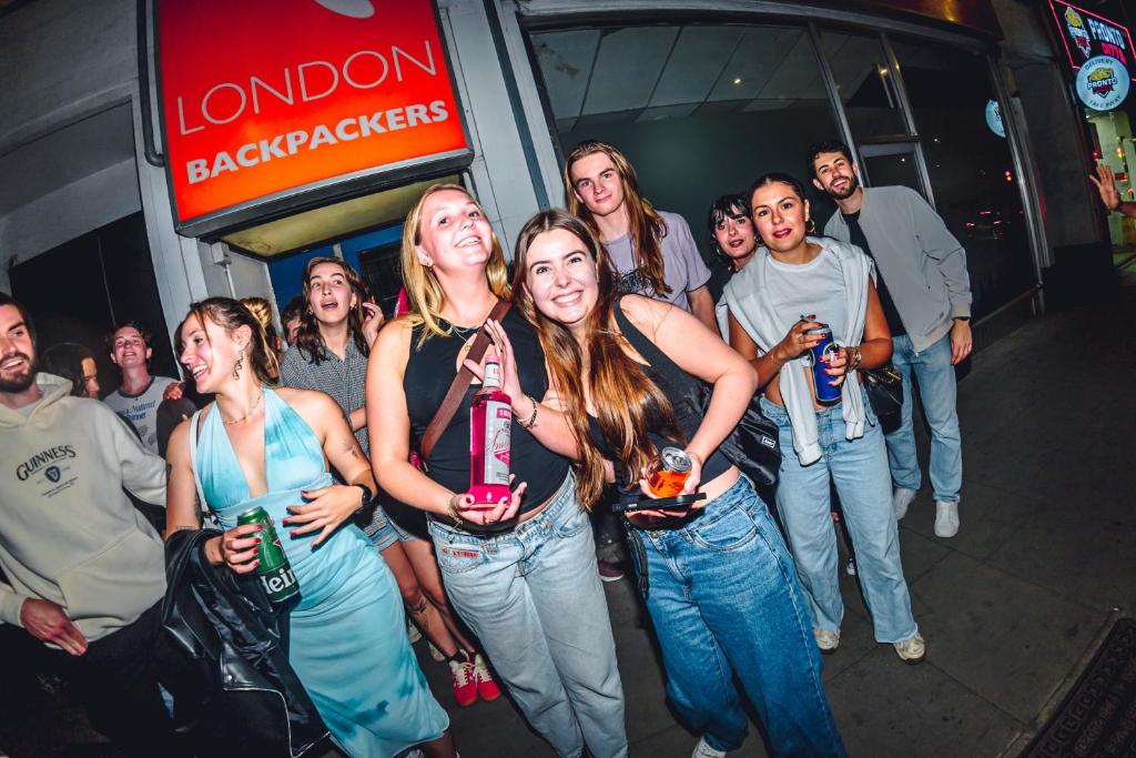 a group of people posing for a picture at a party at London Backpackers Youth Hostel 18 - 35 Years Old Only in London
